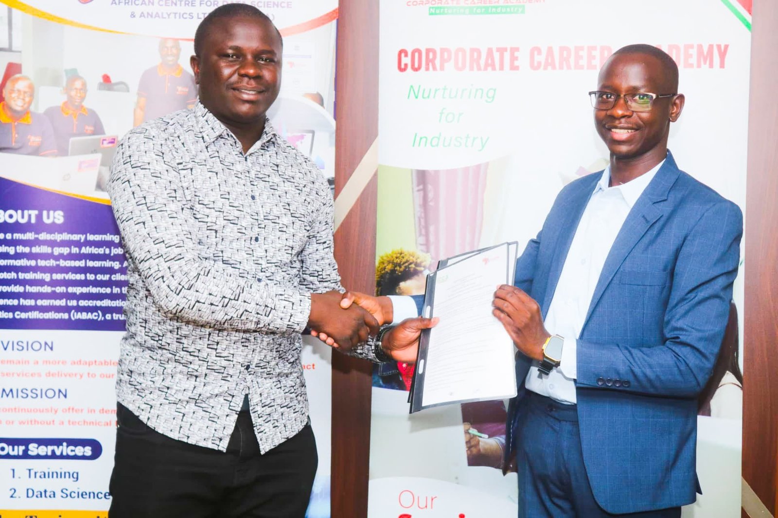 A CCA graduate receiving a certificate at a Corporate Career Academy event